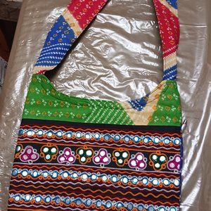 Brand new handbag. Ethnic. Embroidered. shoulder strap. Zipper closing.